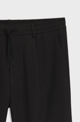 Tapered-fit trousers in water-repellent stretch fabric, Black