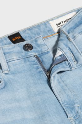 Bootcut jeans in blue stretch denim with slit hems, Light Blue