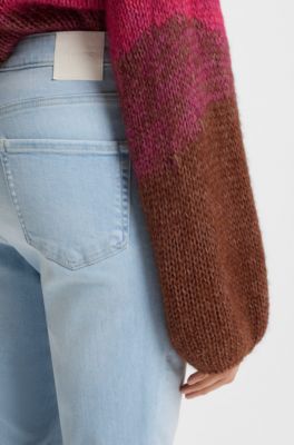 Bootcut jeans in blue stretch denim with slit hems, Light Blue