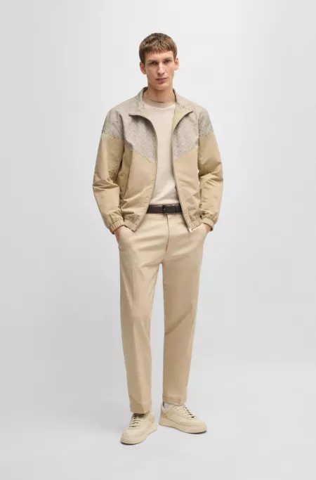 Water-repellent jacket with monogram pattern