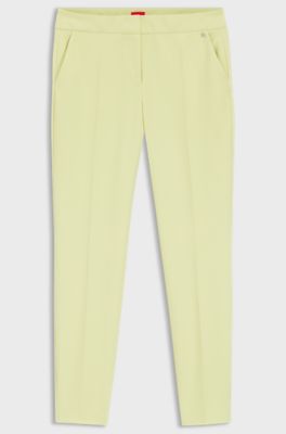 Pantaloni slim fit in tessuto elasticizzato con rivetto con logo, Giallo chiaro