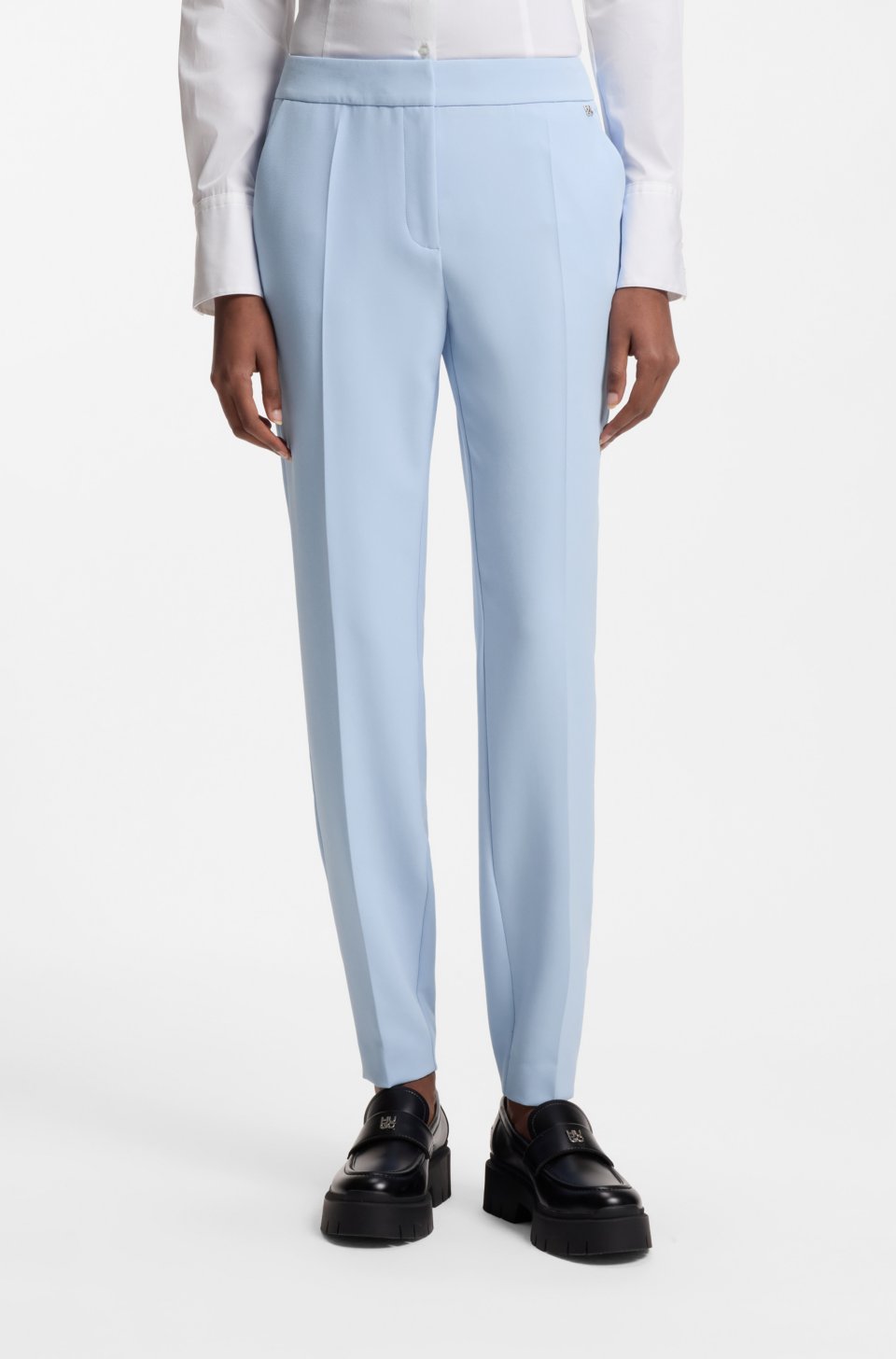 Slim-fit trousers in stretch fabric with logo rivet