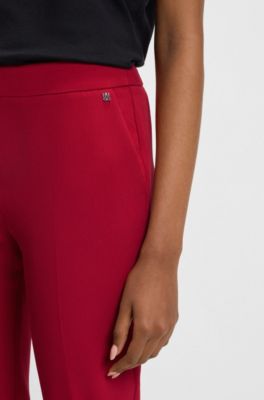 Pantaloni slim fit in tessuto elasticizzato con rivetto con logo, Rosso