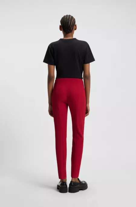 Slim-fit trousers in stretch fabric with logo rivet