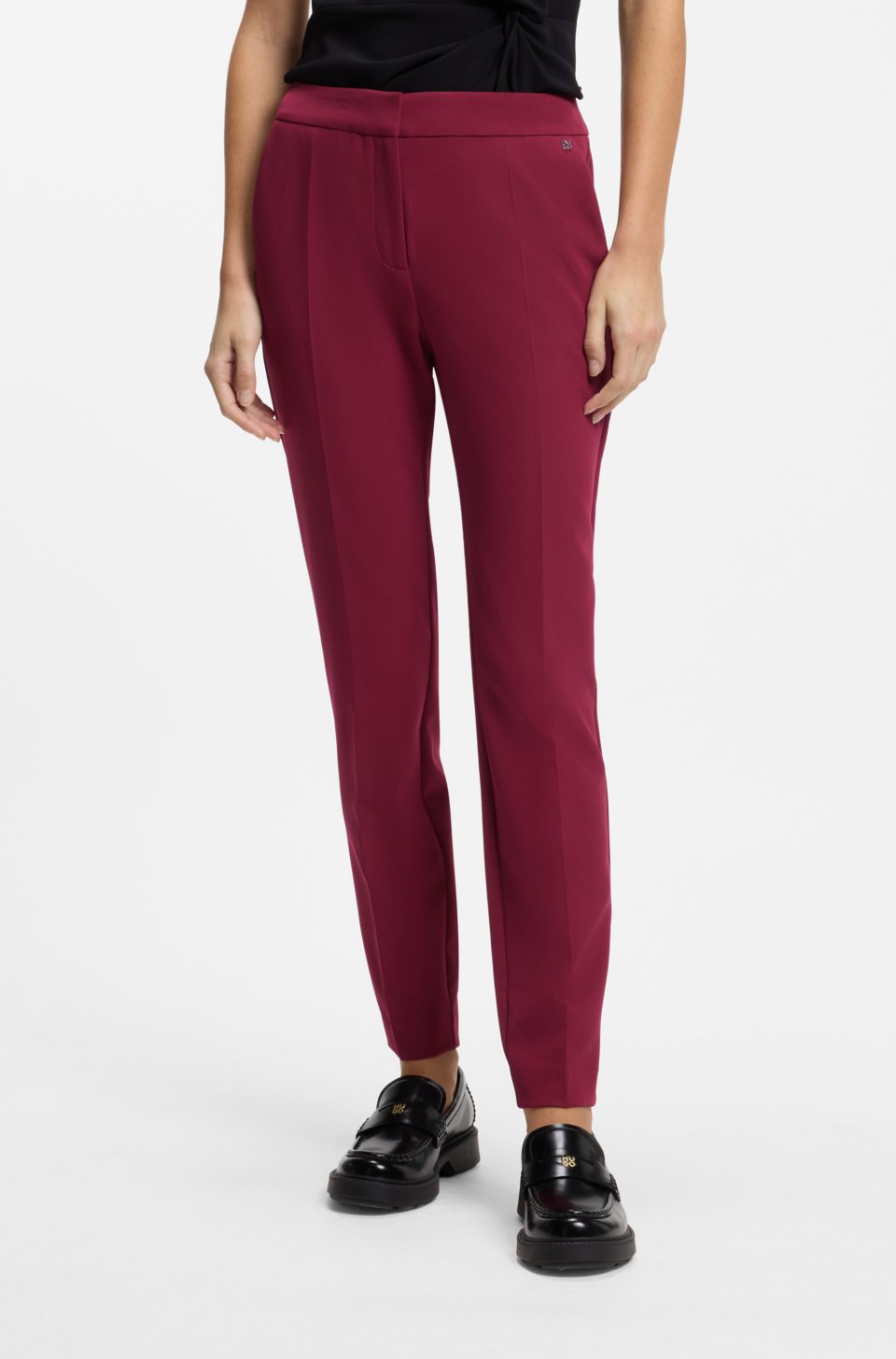 Slim-fit trousers in stretch fabric with logo rivet