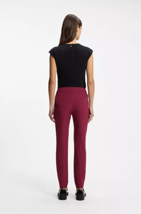 Slim-fit trousers in stretch fabric with logo rivet