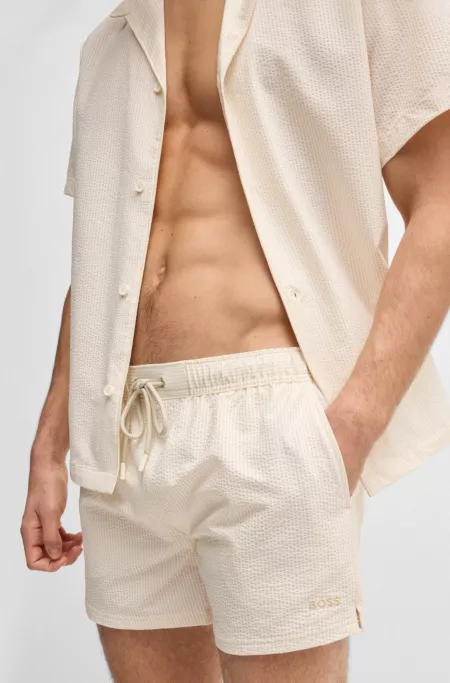 Swim shorts in striped seersucker fabric