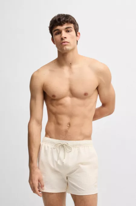 Swim shorts in striped seersucker fabric