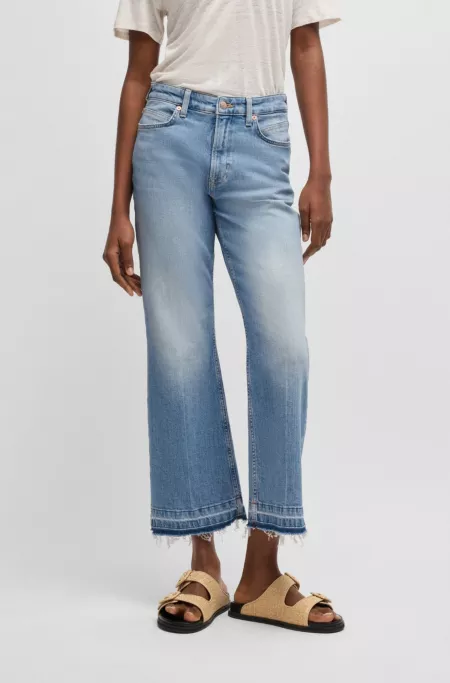 Cropped jeans in blue stretch denim with flared leg