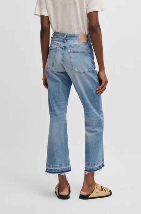 Cropped jeans in blue stretch denim with flared leg