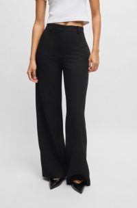 Pantalones regular fit de tejido de sirsaca con elástico, Negro