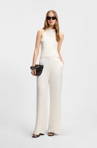Sleeveless jumpsuit in satin with tie neck, White