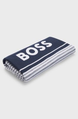Beach towel in cotton with stripes and logo, Blue