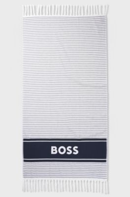 Beach towel in cotton with stripes and logo, Blue
