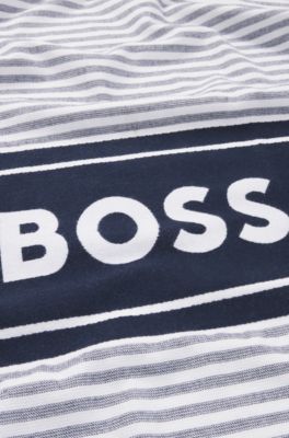 Beach towel in cotton with stripes and logo, Blue