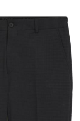 Tapered-fit trousers in stretch seersucker, Black