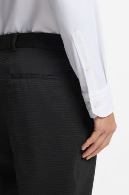 Tapered-fit trousers in stretch seersucker, Black