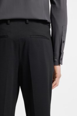 Tapered-fit trousers in stretch seersucker, Black
