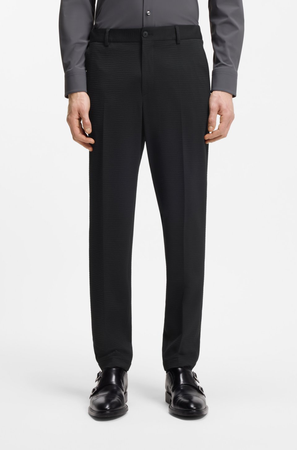 Tapered-fit trousers in stretch seersucker