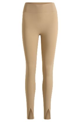 Active leggings in stretch interlock fabric with slit hems