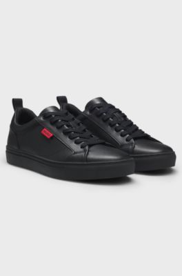 Faux-leather trainers with red logo flag, Black