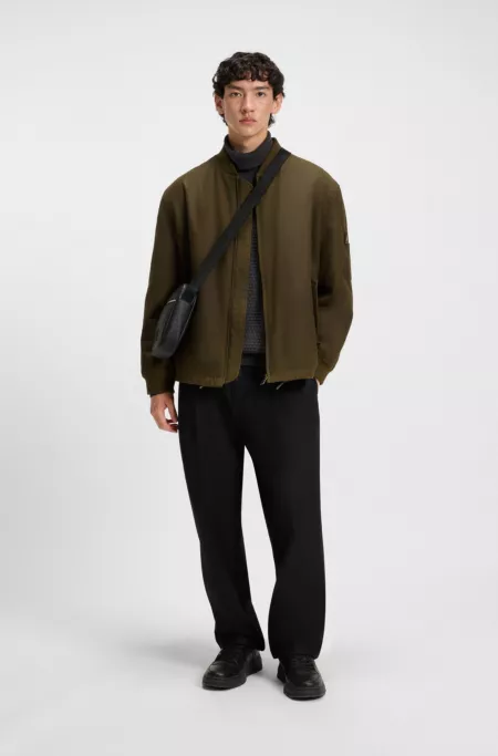 Waxed-cotton bomber jacket with adjustable hem