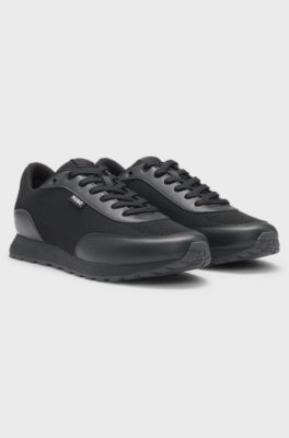 Sneakers met gebreid effect en imitatieleren details, Zwart