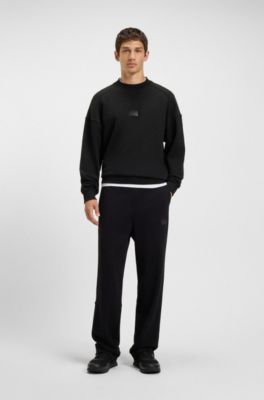 Sneakers met gebreid effect en imitatieleren details, Zwart