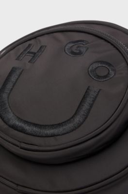 Circular crossbody bag with Happy HUGO logo, Black