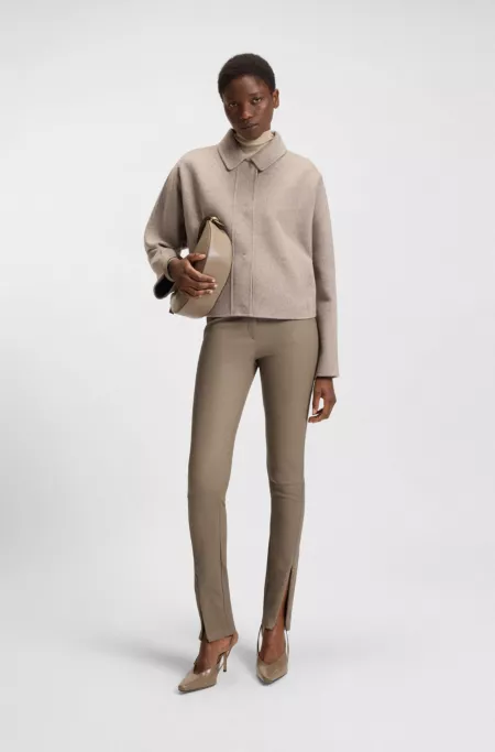 Leather leggings with logo-hook closure