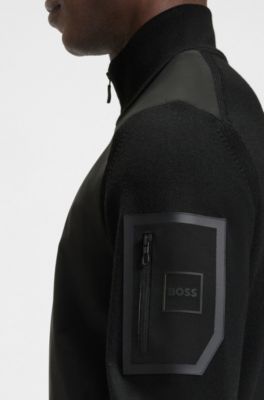 Veste hybride thermor&eacute;gulatrice avec poche zipp&eacute;e sur la manche, Noir