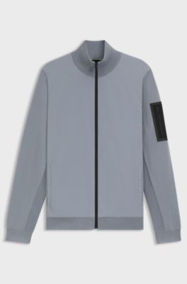 Thermoregulating hybrid jacket with zipped sleeve pocket, Grey