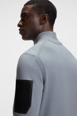 Thermoregulating hybrid jacket with zipped sleeve pocket, Grey