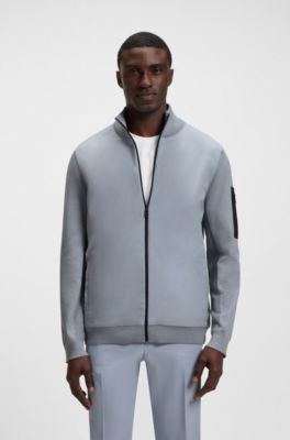 Thermoregulating hybrid jacket with zipped sleeve pocket, Grey