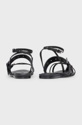 Leather sandals with metallic eyelets and studs, Black