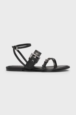 Leather sandals with metallic eyelets and studs, Black