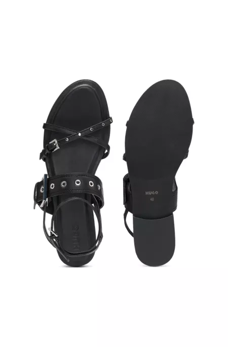 Leather sandals with metallic eyelets and studs