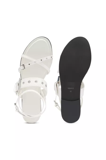 Leather sandals with metallic eyelets and studs