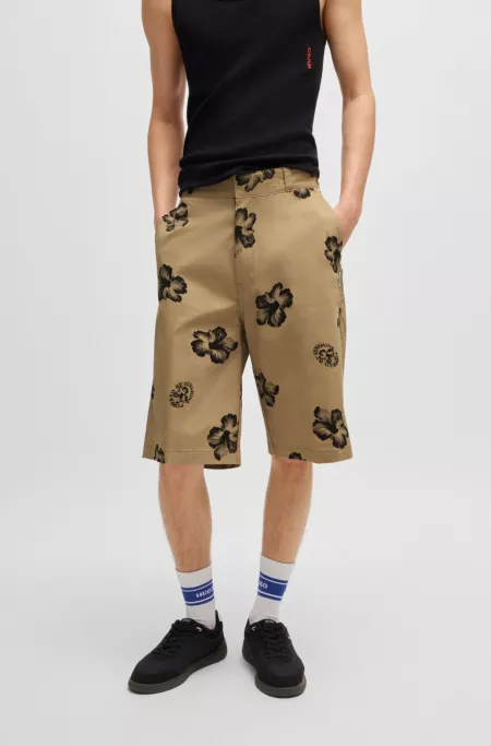 Baggy-fit shorts in hibiscus-print stretch-cotton twill