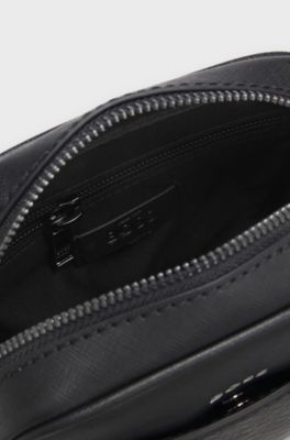 Reporter bag with monogram-patterned front pocket, Black