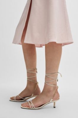 Leather sandals with gold-tone chain, White