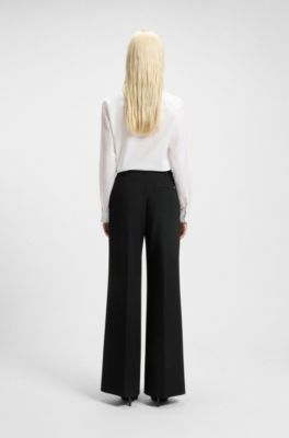 Pantaloni regular fit con gamba svasata in tessuto elasticizzato, Nero