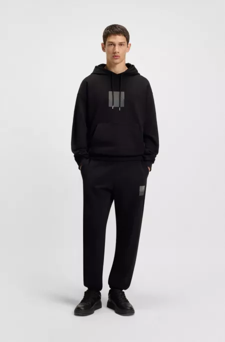 Cotton-terry tracksuit bottoms with split logo