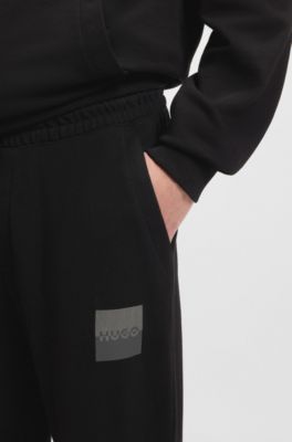 Trainingsbroek van katoenen sweatstof met tweedelig logo, Zwart