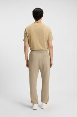 Cotton-terry tracksuit bottoms with split logo, Beige