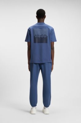 Cotton-terry tracksuit bottoms with split logo, Blue