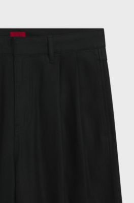 Relaxed-fit jeans in black waxed denim, Black