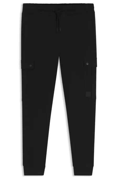 Relaxed-fit cotton-terry tracksuit bottoms with cargo pockets