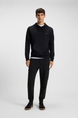 Relaxed-fit cotton-terry tracksuit bottoms with cargo pockets, Black