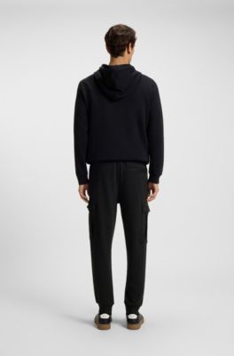 Relaxed-fit cotton-terry tracksuit bottoms with cargo pockets, Black